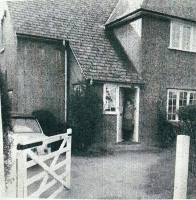 Margaret standing in the doorway of her first house in Duncombe Road, Hertford